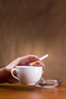 Hand holding a cigarette