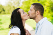 Young beautiful pair kisses