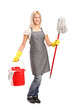 Full length portrait of a female cleaner holding a bucket with c