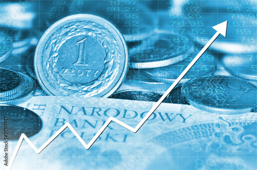 Photo: Arrow graph going down and polish currency in background Arrow graph going down and polish currency in background