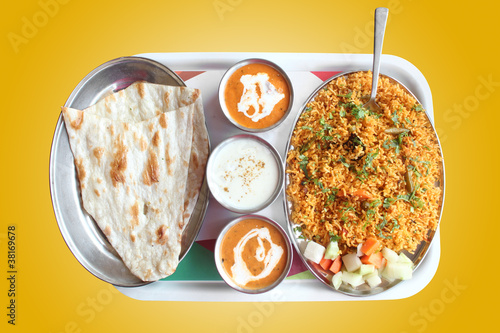 Photo: Indian biryani, butter naan with spicy curry Indian biryani, butter naan with spicy curry