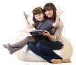 Mother and daughter reading a book on white background.