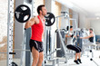 Foto: man with dumbbell weight training equipment gym man with dumbbell weight training equipment gym