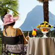 beautiful woman on the terrace of prestigious hotel