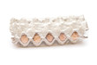 Brown eggs in a carton package on white background