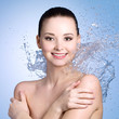 Cheerful woman with splashes of water