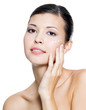 adult  woman applying cosmetic  cream around the eye