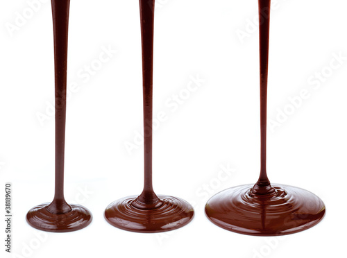 Photo: Hot chocolate stream isolated on white Hot chocolate stream isolated on white