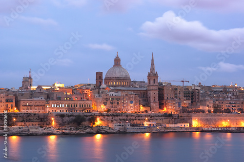 night view of Valletta with the St. Pauls Cathedral and Charmelite Church at the twilight
