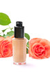 Natural cosmetics concept: foundation cream with roses, on white