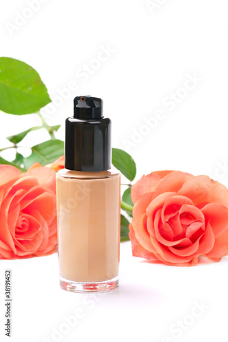 Photo: Natural cosmetics concept: foundation cream with roses, on white Natural cosmetics concept: foundation cream with roses, on white