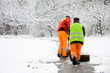 Foto: Unidentified workers removing first snow from pavement Unidentified workers removing first snow from pavement