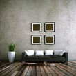 Wohndesign - schwarzes Ledersofa vor Betonwand