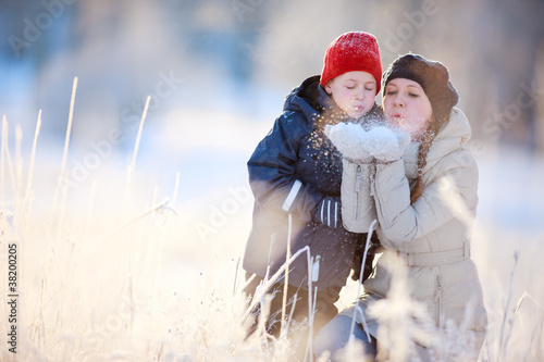 Photo: Mother and son outdoors at winter Mother and son outdoors at winter