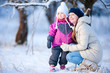 Mother and daughter outdoors at winter