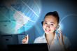 Young woman in business wear and headset