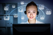 Young woman in business wear and headset