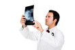 doctor examining an x-ray and looking worried, isolated on white doctor examining an x-ray and looking worried, isolated on white