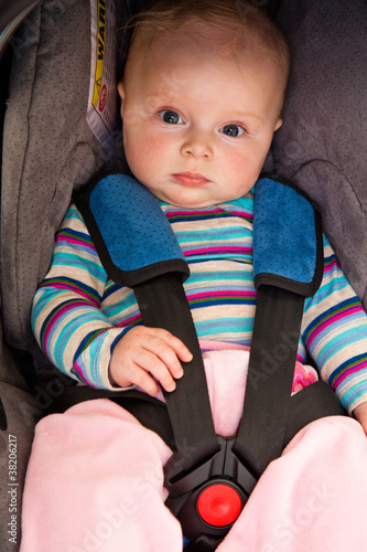 Photo: Infant child sitting in car seat Infant child sitting in car seat