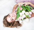 Photo: Dreaming lovely young girl with bouquet of flowers Dreaming lovely young girl with bouquet of flowers