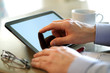 Finge touching screen of a digital tablet