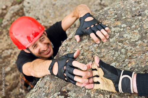 Photo: Climber Lending Helping Hand Climber Lending Helping Hand