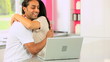 Asian Couple with Laptop Having Success Online