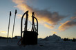 sledge in the tyrolean alps with blue cloudy sky in front chalet