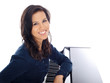 smiling teenage girl by the piano