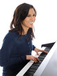 smiling teenage girl playing piano
