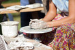 hand on a potter wheel at the fair