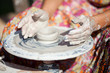 hand on a potter wheel at the fair