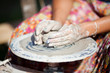 hand on a potter wheel at the fair