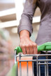 Photo: Female Shopper with Trolley at Supermarket Female Shopper with Trolley at Supermarket