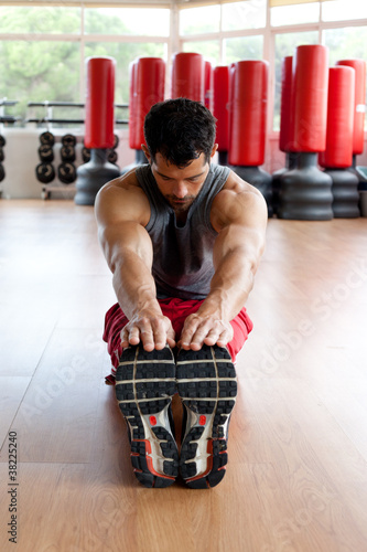 Photo: Muscular man stretching Muscular man stretching