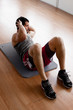 Handsome man doing sit-ups