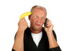 Desperate man phoning with banana gun against his head