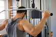 Muscular man lifting weights
