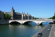 Palais de Justice and bridge over Seine river in Paris, France