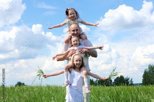 Photo: family with children in summer day outdoors family with children in summer day outdoors