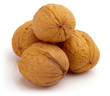 Stack of four walnuts. Isolated on a white background.