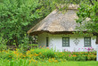Photo: Ancient traditional ukrainian rural cottage with a straw roof Ancient traditional ukrainian rural cottage with a straw roof
