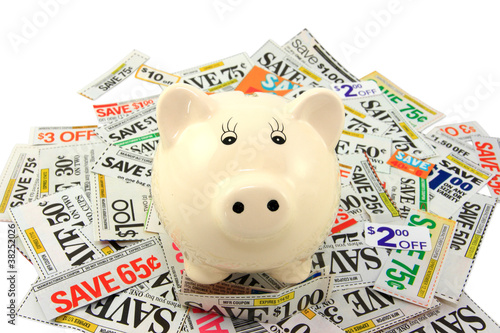 Photo: Piggy Bank Standing On Grocery Coupons Piggy Bank Standing On Grocery Coupons