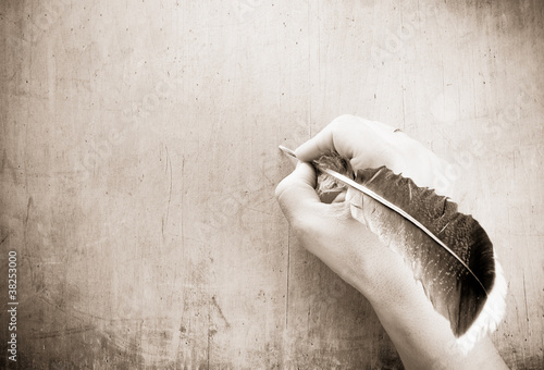 Photo: writing hand and pen on wood writing hand and pen on wood