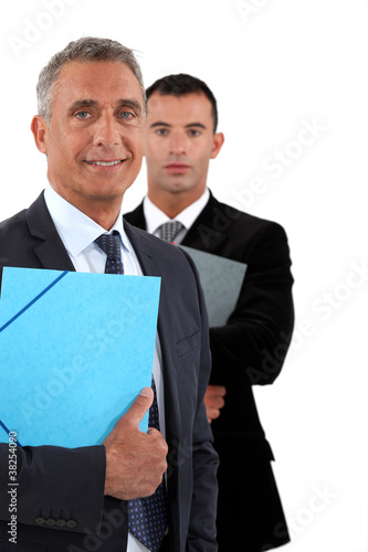 Photo: Older and younger businessmen Older and younger businessmen