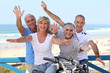 happy foursome gone for a ride by oceanfront