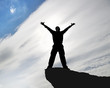 Man on top of mountain.