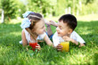 Photo: Little brother and sister in summer park Little brother and sister in summer park