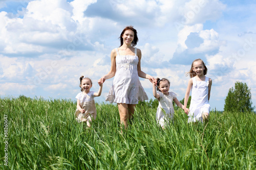 Photo: family with children in summer day outdoors family with children in summer day outdoors
