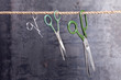 Three scissors hanging on a rope